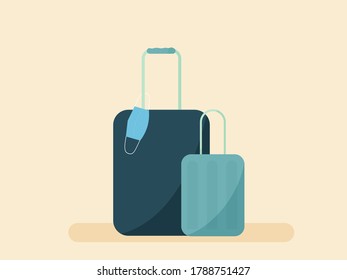 Travel safety and new normal. Blue suitcases on beige background with a shadow and a medical face mask on one of the suitcases. Poster, logo, banner. Travel with coronavirus. 