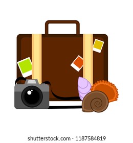 Travel suitcase with a camera and seashells