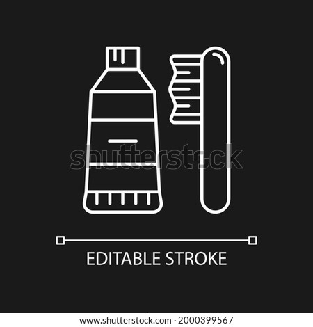 Travel toothbrush white linear icon for dark theme. Mini brush and toothpaste. Hygiene amenity. Thin line customizable illustration. Isolated vector contour symbol for night mode. Editable stroke