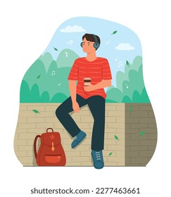 Traveler Man Sitting in Public Park and Listening Music from Headphones