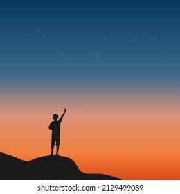 Traveler standing on top of a mountain with sunset background. Exploration, hiking, adventure tourism, and travel.
