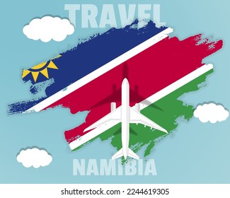 Traveling to Namibia, top view passenger plane on Namibia flag with clouds and weather, country tourism banner idea, vector design, brush splash