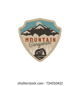 Traveling, outdoor badge. Mountain conqueror emblem. Vintage hand drawn design. Retro colors palette. Stock vector illustration, insignia, rustic patch. Isolated on white background.