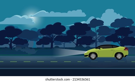 Traveling of sport car yellow color driving on the asphalt road on night time. Turn on the headlights and the light hits the ground. ฺBackgroun of trees forest under night sky with moon and clouds.