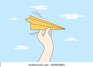 Travelling, business, delivery, flight concept. Man woman cartoon hands hold handmade paper plane flying in sky demonstrating email letter delivering. Leisure games and travel journey illustration.