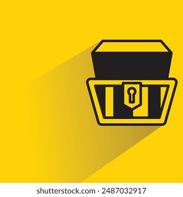 icono del cofre del tesoro con sombra sobre fondo amarillo