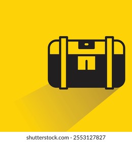 Icono del cofre del tesoro con la sombra sobre fondo amarillo