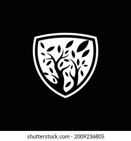 tree and fallen leaves shield logo company ready to use. logo design vector template. modern logo concept.