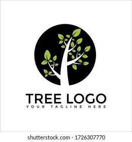TREE WITH GREEN LEAFS IN A BLACK CIRCLE