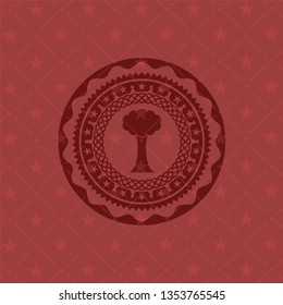 tree icon inside badge with red background