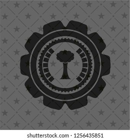 tree icon inside black emblem