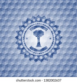 tree icon inside blue hexagon emblem.