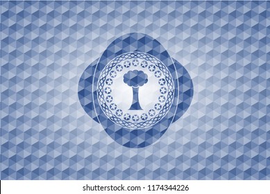 tree icon inside blue polygonal emblem.