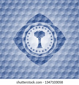 tree icon inside blue polygonal badge.