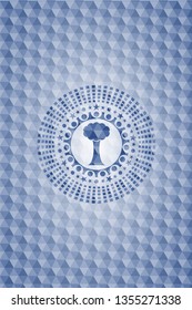 tree icon inside blue polygonal badge.