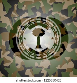 tree icon inside camouflaged emblem