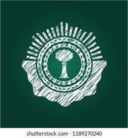 tree icon inside chalk emblem written on a blackboard