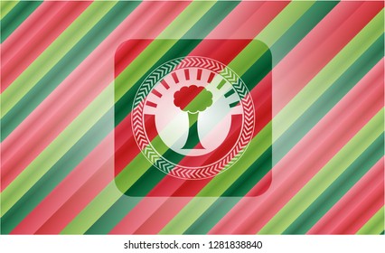tree icon inside christmas colors style emblem.