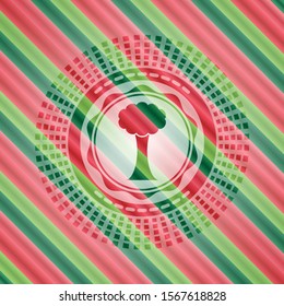 tree icon inside christmas colors style emblem.