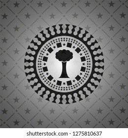 tree icon inside dark badge or emblem