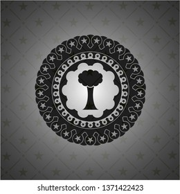 tree icon inside dark badge or emblem