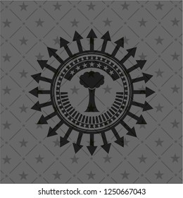 tree icon inside dark emblem