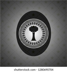 tree icon inside dark emblem