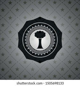 tree icon inside dark emblem. Retro