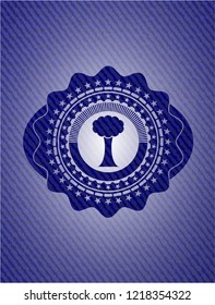 tree icon inside emblem with jean texture