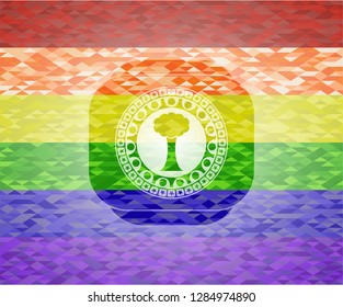 tree icon inside emblem on mosaic background with the colors of the LGBT flag