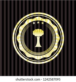 tree icon inside gold emblem or badge