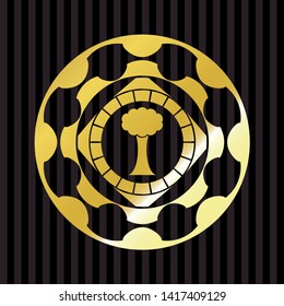 tree icon inside gold emblem