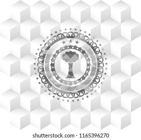 tree icon inside grey badge with geometric cube white background