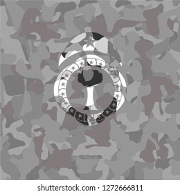 tree icon inside grey camo texture