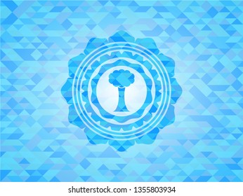 tree icon inside light blue emblem. Mosaic background