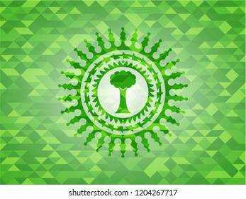 tree icon inside realistic green mosaic emblem