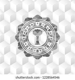 tree icon inside realistic grey emblem with geometric cube white background