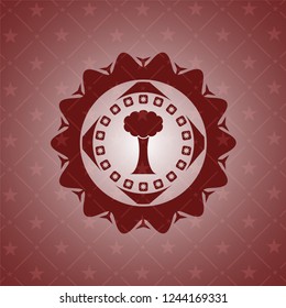 tree icon inside red emblem