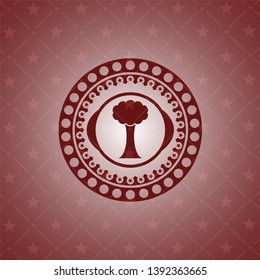 tree icon inside red emblem