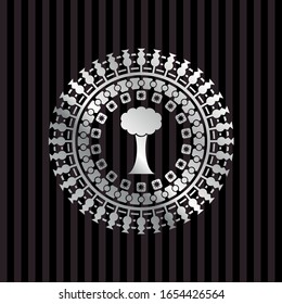 tree icon inside silver emblem or badge