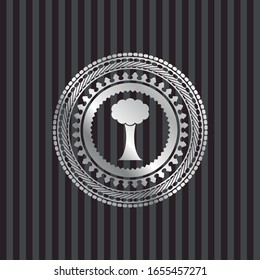 tree icon inside silvery emblem or badge
