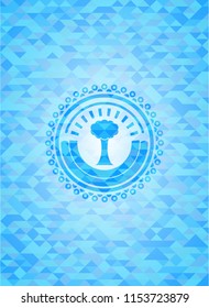 tree icon inside sky blue mosaic emblem