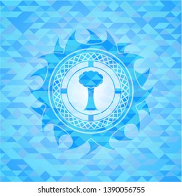 tree icon inside sky blue emblem with mosaic ecological style background