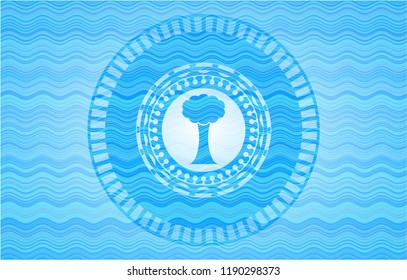 tree icon inside water representation style emblem.