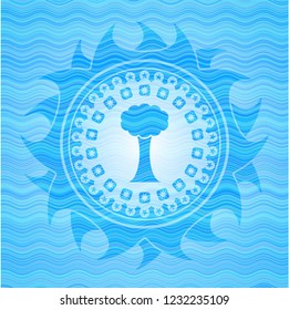 tree icon inside water wave representation style emblem.