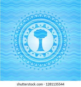 tree icon inside water wave representation style badge.