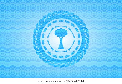 tree icon inside water wavec oncept emblem.