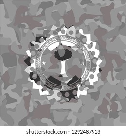 tree icon on grey camouflaged pattern