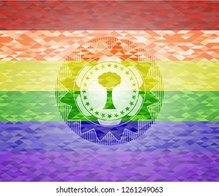tree icon on mosaic background with the colors of the LGBT flag