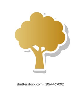 Tree icon. Vector. Golden gradient icon with white contour and rotated gray shadow at white background.